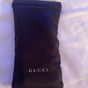 Gucci sunglasses with black frame and red and green on the sides